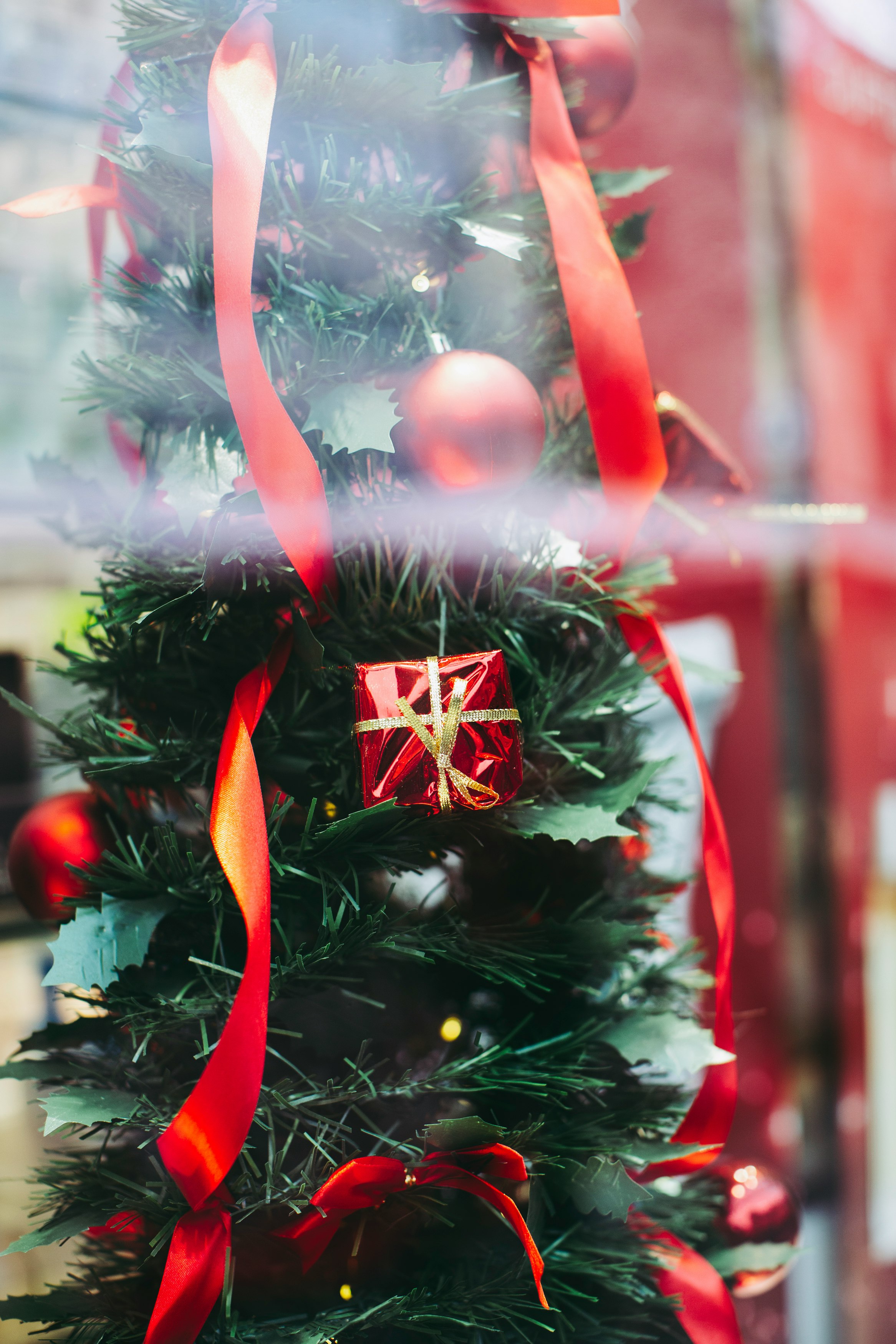 red and white christmas tree with baubles